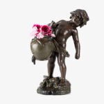 Sculpture by Auguste Moreau “Le pot cassé” 19th century A boy carries a large broken water pitcher pouring the contents, the green patinated pitcher is a small vase. The figure, a fine example of late 19th century French Art Nouveau, is finely cast in patinated technical zinc.