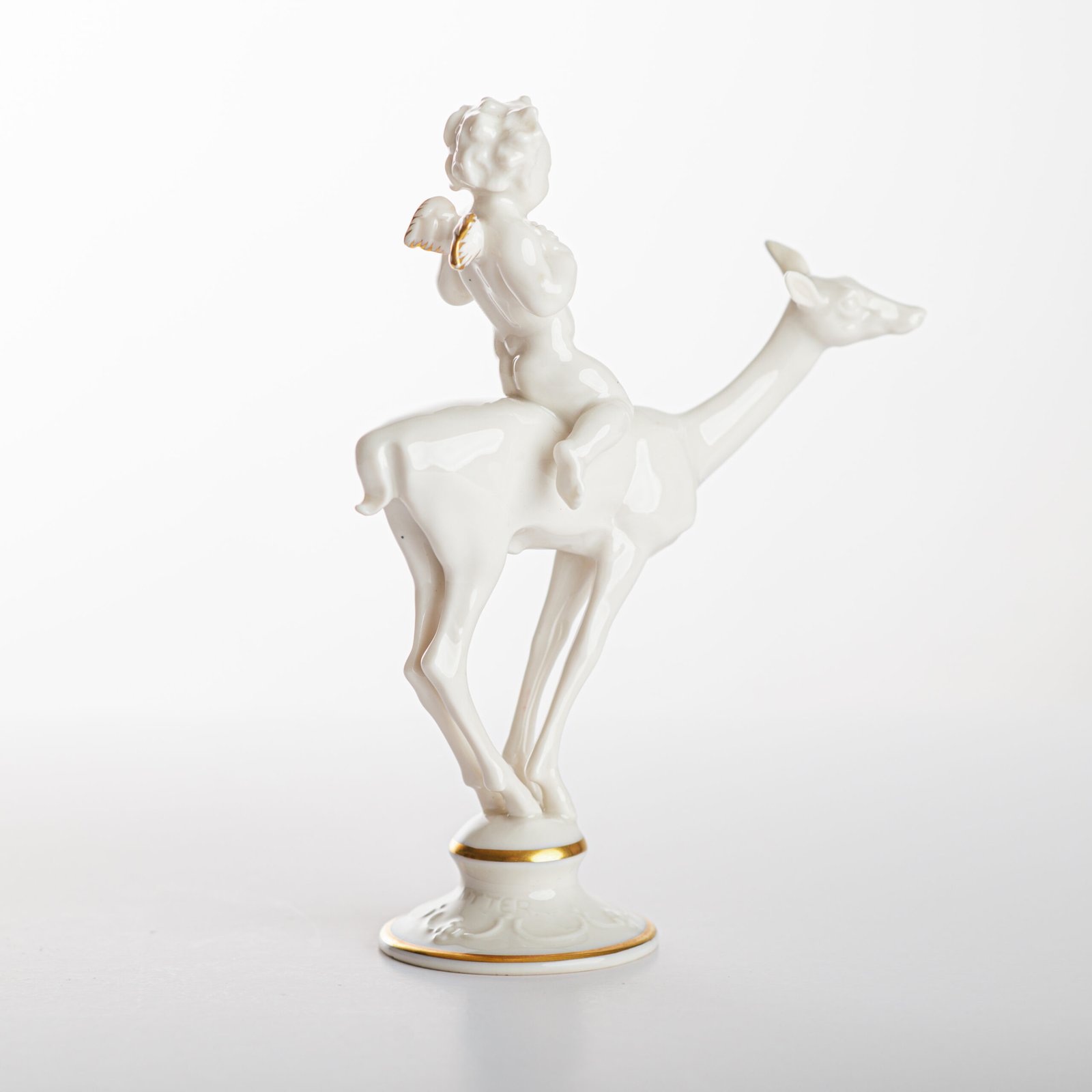 Karl Tutter 'Puto Auf Reh' Porcelain figurine 1920's High quality white enameled porcelain figurine with golden details, made by the prestigious artist Karl Tutter for the famous firm Hutschenreuther.