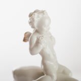 Karl Tutter 'Puto Auf Reh' Porcelain figurine 1920's High quality white enameled porcelain figurine with golden details, made by the prestigious artist Karl Tutter for the famous firm Hutschenreuther.