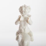 Karl Tutter 'Puto Auf Reh' Porcelain figurine 1920's High quality white enameled porcelain figurine with golden details, made by the prestigious artist Karl Tutter for the famous firm Hutschenreuther.