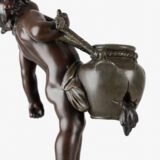 Sculpture by Auguste Moreau “Le pot cassé” 19th century A boy carries a large broken water pitcher pouring the contents, the green patinated pitcher is a small vase. The figure, a fine example of late 19th century French Art Nouveau, is finely cast in patinated technical zinc.