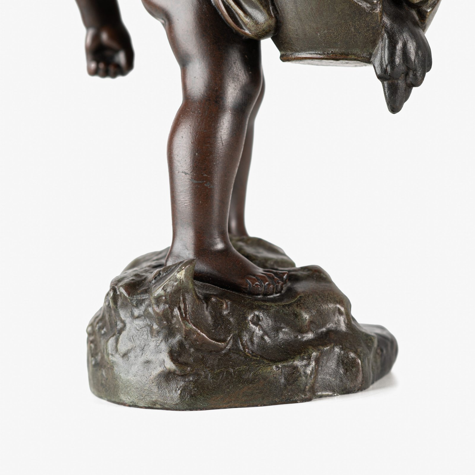 Sculpture by Auguste Moreau “Le pot cassé” 19th century A boy carries a large broken water pitcher pouring the contents, the green patinated pitcher is a small vase. The figure, a fine example of late 19th century French Art Nouveau, is finely cast in patinated technical zinc.