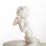 Karl Tutter 'Puto Auf Reh' Porcelain figurine 1920's High quality white enameled porcelain figurine with golden details, made by the prestigious artist Karl Tutter for the famous firm Hutschenreuther.