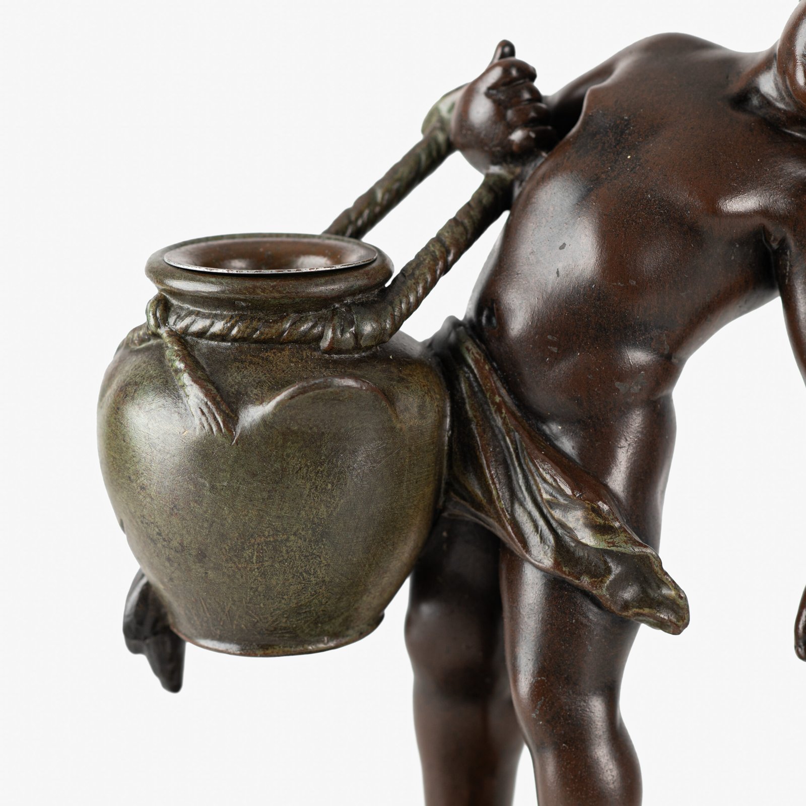 Sculpture by Auguste Moreau “Le pot cassé” 19th century A boy carries a large broken water pitcher pouring the contents, the green patinated pitcher is a small vase. The figure, a fine example of late 19th century French Art Nouveau, is finely cast in patinated technical zinc.