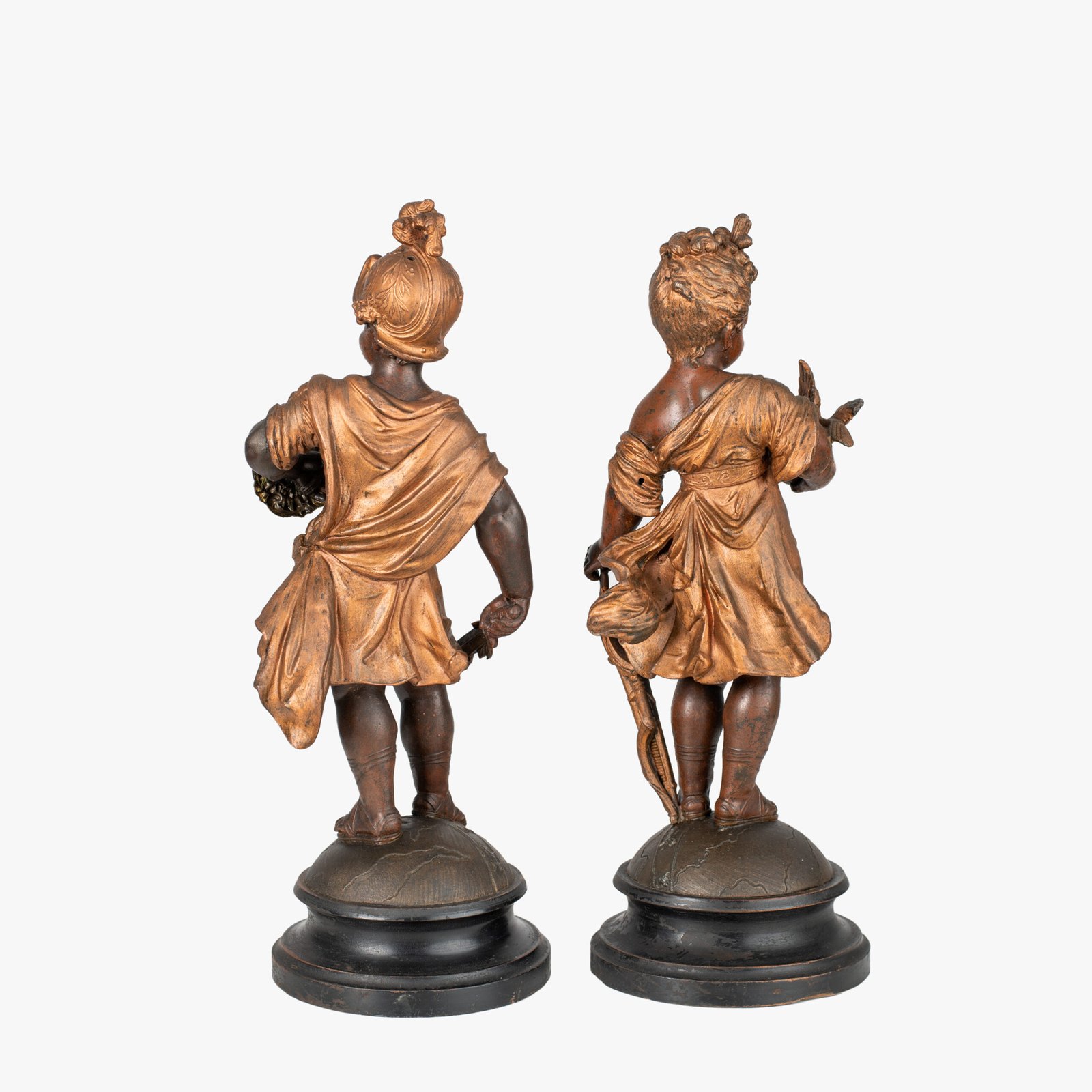 Treasures of Olympus: Sculptures of Mars and Diana - 19th Century Embark on a journey to Olympus with this exquisite pair of neoclassical sculptures depicting the Roman gods Mars and Diana in their infancy. Cast in high quality spelter, finished with a rich brown and gold patina and elevated on wooden bases, these 19th century statuettes are a true work of art.