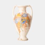 Plateelbakkerij Zuid-Holland ceramic vase “Orchids”, Art Nouveau, model 326 D, Gouda (1919). Hand painted, decorated with a beautiful floral composition of orchids. The flowers are painted in vibrant tones, with details in blue, green and orange-brown.