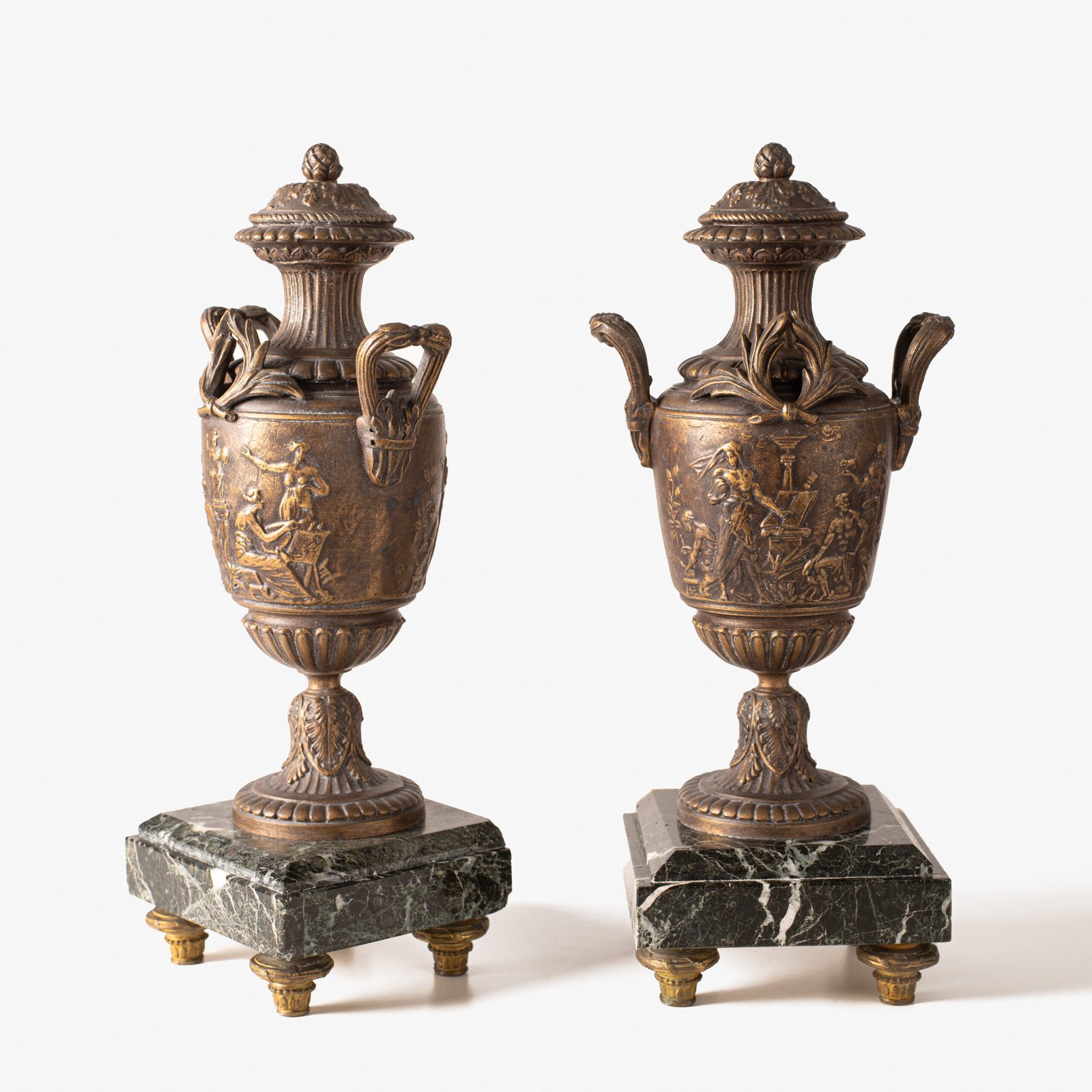 E. Picault pair of French cassolettes 19th century. Important mantelpiece that includes two elegant covered “cassolettes” vases, cast in spelter and patinated in brown and gilt bronze, second half of the 19th century.