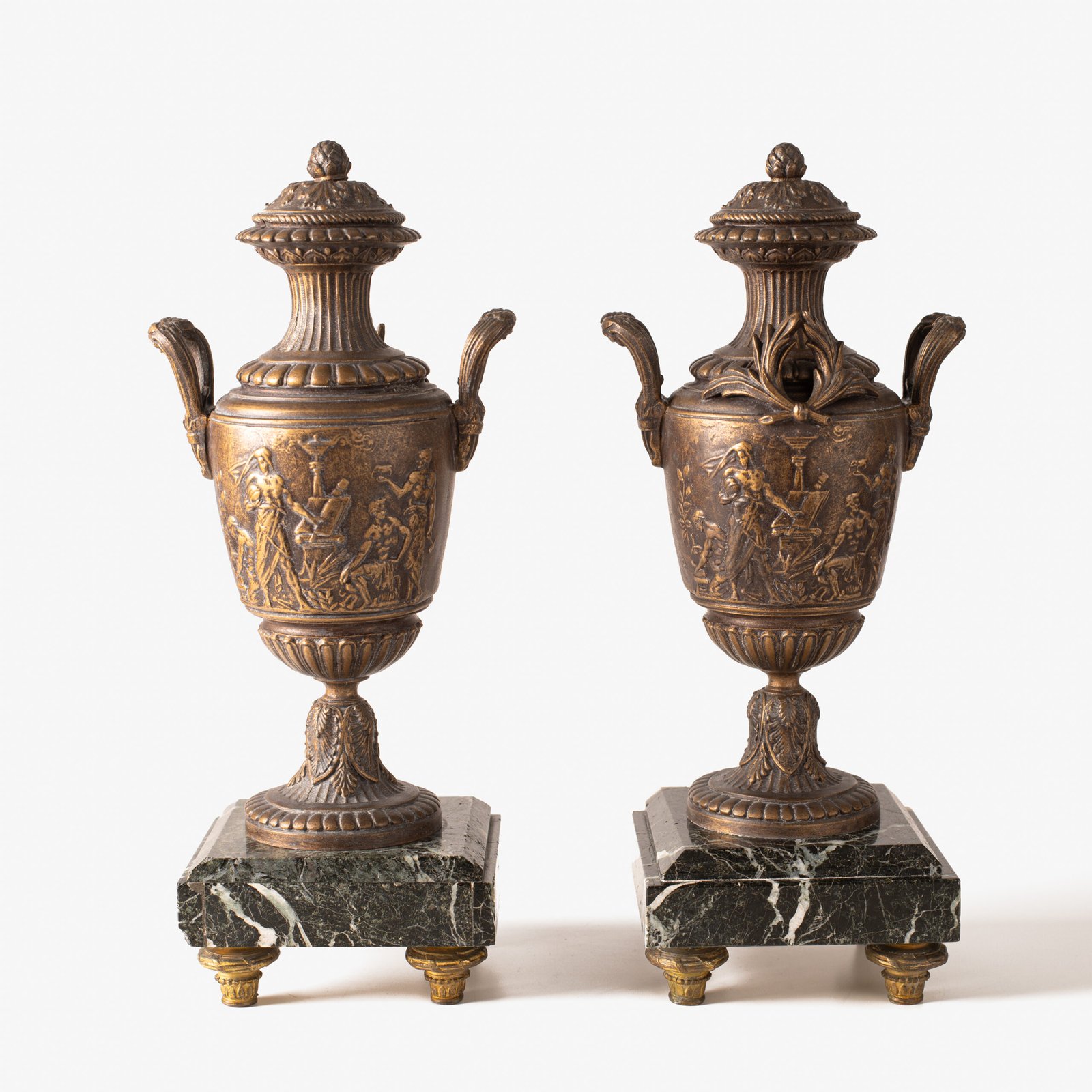 E. Picault pair of French cassolettes 19th century. Important mantelpiece that includes two elegant covered “cassolettes” vases, cast in spelter and patinated in brown and gilt bronze, second half of the 19th century.