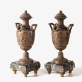 E. Picault pair of French cassolettes 19th century. Important mantelpiece that includes two elegant covered “cassolettes” vases, cast in spelter and patinated in brown and gilt bronze, second half of the 19th century.