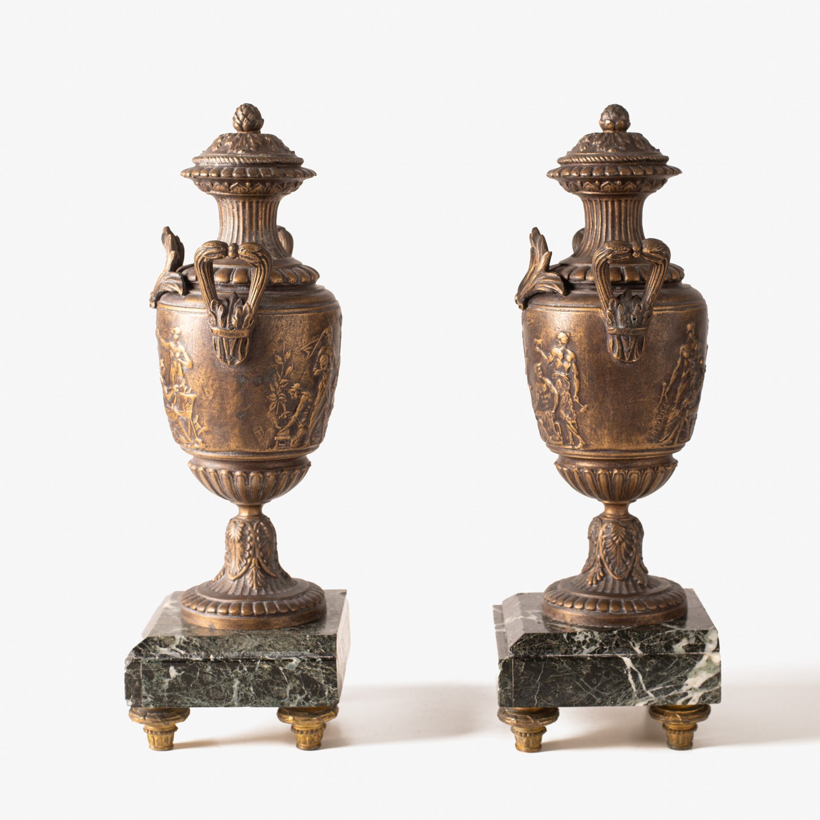 E. Picault pair of French cassolettes 19th century. Important mantelpiece that includes two elegant covered “cassolettes” vases, cast in spelter and patinated in brown and gilt bronze, second half of the 19th century.