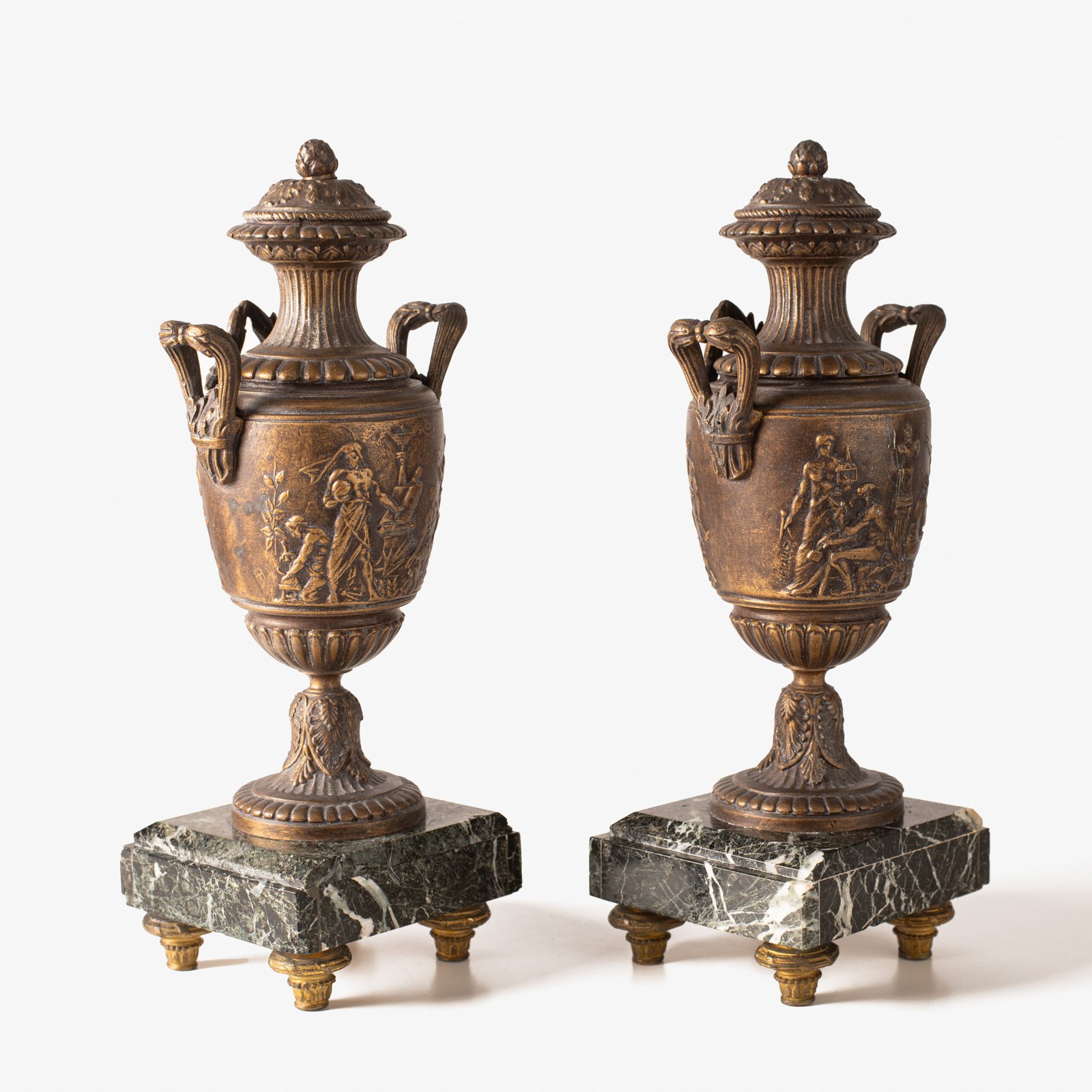 E. Picault pair of French cassolettes 19th century. Important mantelpiece that includes two elegant covered “cassolettes” vases, cast in spelter and patinated in brown and gilt bronze, second half of the 19th century.