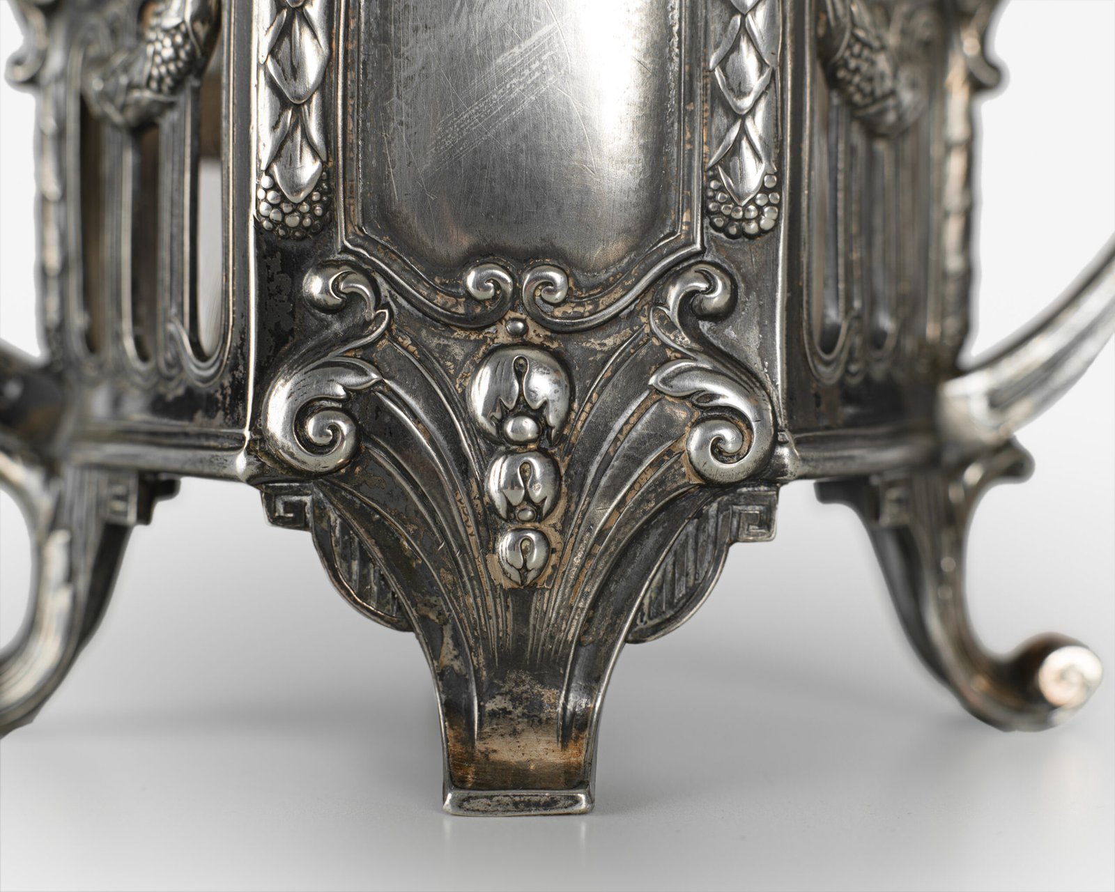 Made in Germany around 1900 by the prestigious WMF Geislingen company, the vases are decorated with garlands and organic motifs in a majestic expression of the style.