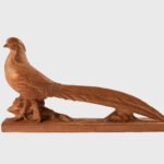 magnificent "Golden Pheasant" terracotta sculpture by Henri Bargas! Crafted by the renowned French sculptor in the 1920s, this stunning piece encapsulates the essence of Art Deco.