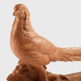 magnificent "Golden Pheasant" terracotta sculpture by Henri Bargas! Crafted by the renowned French sculptor in the 1920s, this stunning piece encapsulates the essence of Art Deco.