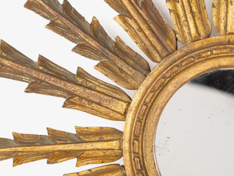 Sunburst Mirror, gilded elm wood, Portugal 1910's This is a product with vintage charm and elegance, handcrafted, emanating an aura of distinction. This magnificent sunburst mirror is a masterpiece from the early 20th century (1900-1910).