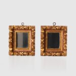 Antique pair of 18th century Spanish Baroque mirrors, carved and gilded wood. Immerse yourself in history with this exceptional pair of 18th century Spanish mirrors. Made of hand carved pine wood, these mirrors are notable for their rich high relief decorations.