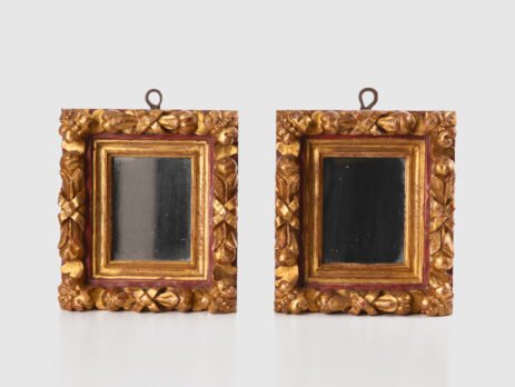 Antique pair of 18th century Spanish Baroque mirrors, carved and gilded wood. Immerse yourself in history with this exceptional pair of 18th century Spanish mirrors. Made of hand carved pine wood, these mirrors are notable for their rich high relief decorations.