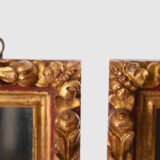 Antique pair of 18th century Spanish Baroque mirrors, carved and gilded wood. Immerse yourself in history with this exceptional pair of 18th century Spanish mirrors. Made of hand carved pine wood, these mirrors are notable for their rich high relief decorations.