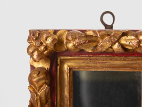 Antique pair of 18th century Spanish Baroque mirrors, carved and gilded wood. Immerse yourself in history with this exceptional pair of 18th century Spanish mirrors. Made of hand carved pine wood, these mirrors are notable for their rich high relief decorations.