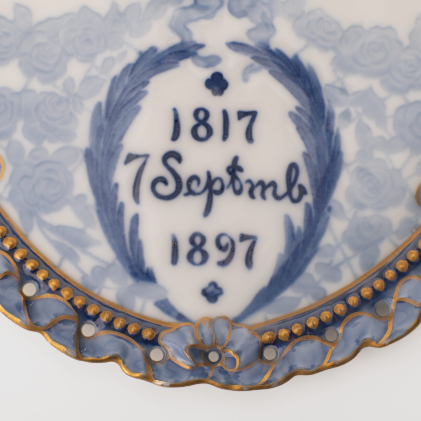 Royal Copenhagen porcelain plates by Arnold Krog, 19th century. Commemorative medallion plates, made by the renowned Arnold Krog for Royal Copenhagen, celebrate the 80th birthday of Denmark's King Christian IX and his wife, Queen Louise of Hesse-Kassel.