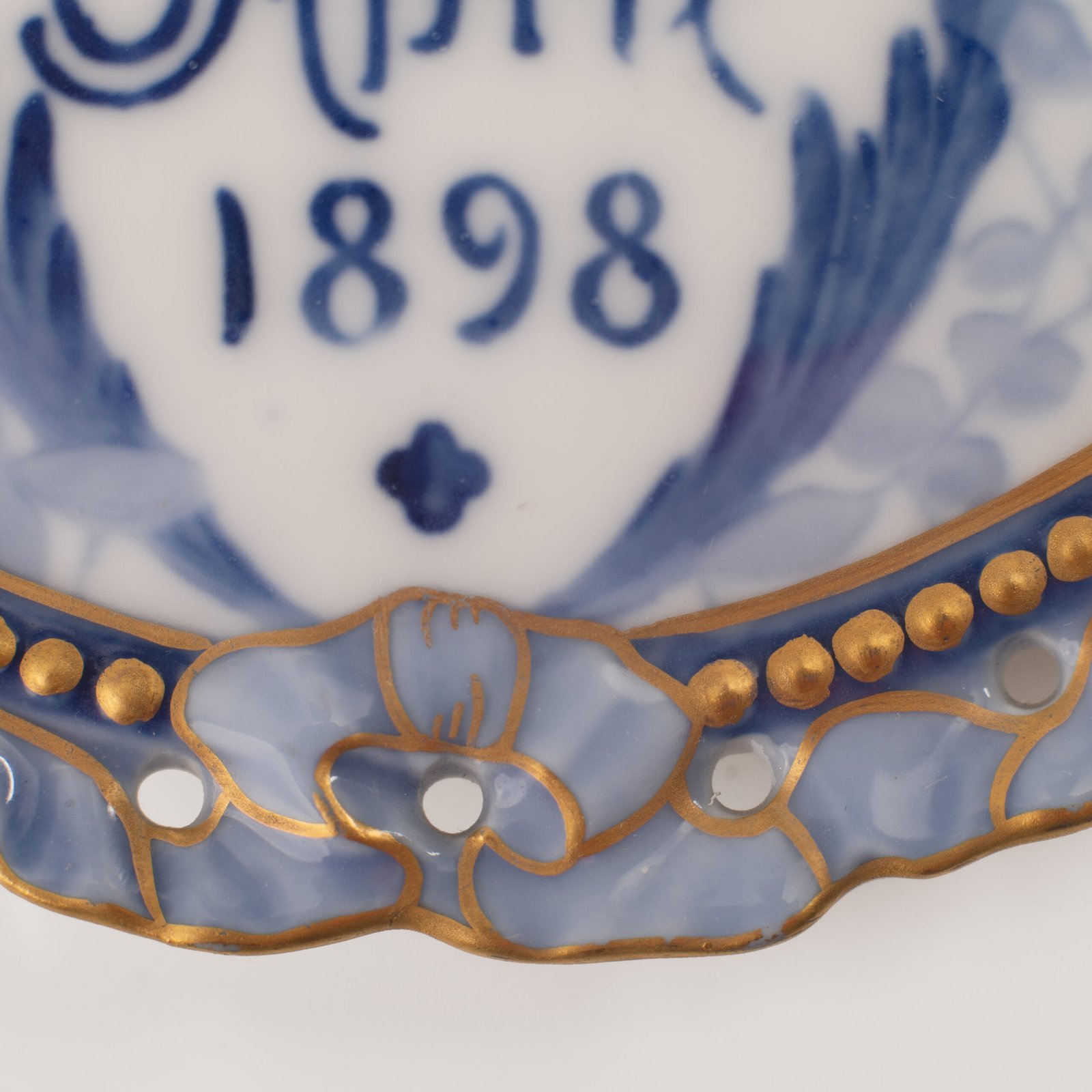 Royal Copenhagen porcelain plates by Arnold Krog, 19th century. Commemorative medallion plates, made by the renowned Arnold Krog for Royal Copenhagen, celebrate the 80th birthday of Denmark's King Christian IX and his wife, Queen Louise of Hesse-Kassel.