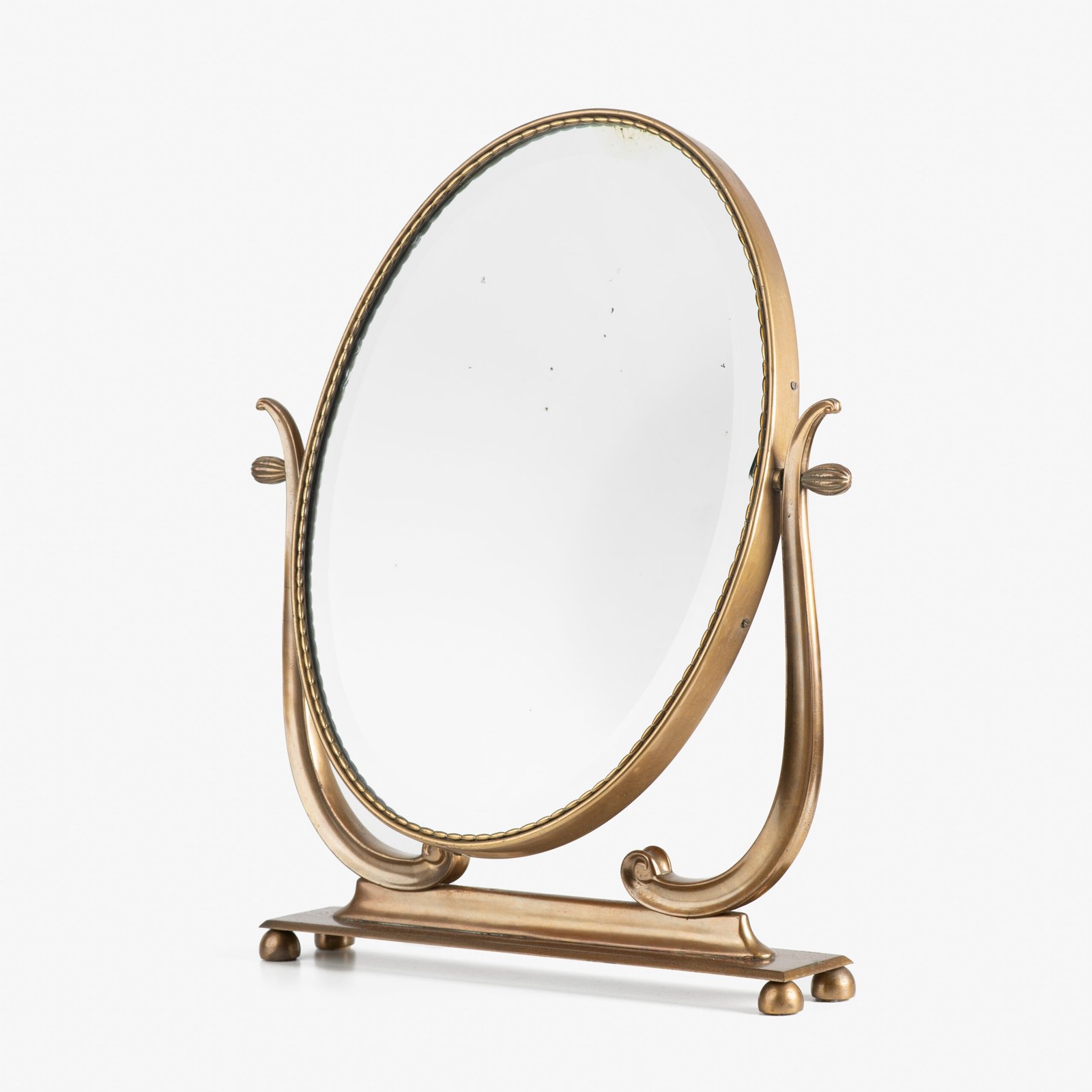 Italian Art Deco Bronze Lyre Mirror, a 1930's collector's item. Discover this refined Italian Art Deco bronze dressing table mirror, whose lyre design and beveled glass make it a unique piece full of character.