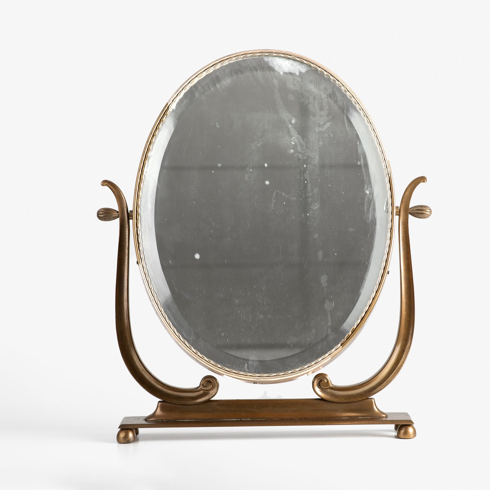 Italian Art Deco Bronze Lyre Mirror, a 1930's collector's item. Discover this refined Italian Art Deco bronze dressing table mirror, whose lyre design and beveled glass make it a unique piece full of character.