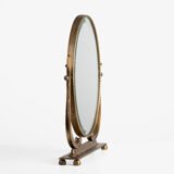 Italian Art Deco Bronze Lyre Mirror, a 1930's collector's item. Discover this refined Italian Art Deco bronze dressing table mirror, whose lyre design and beveled glass make it a unique piece full of character.