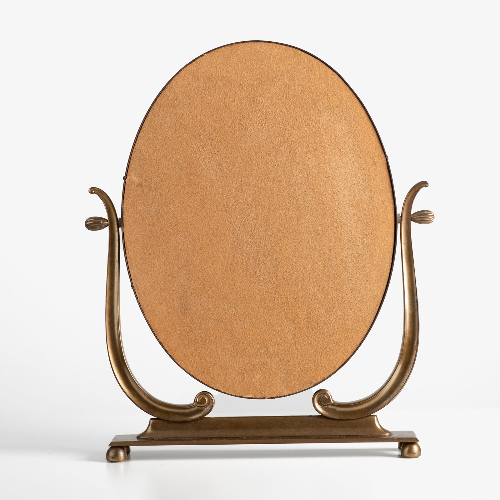 Italian Art Deco Bronze Lyre Mirror, a 1930's collector's item. Discover this refined Italian Art Deco bronze dressing table mirror, whose lyre design and beveled glass make it a unique piece full of character.