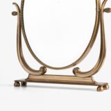 Italian Art Deco Bronze Lyre Mirror, a 1930's collector's item. Discover this refined Italian Art Deco bronze dressing table mirror, whose lyre design and beveled glass make it a unique piece full of character.