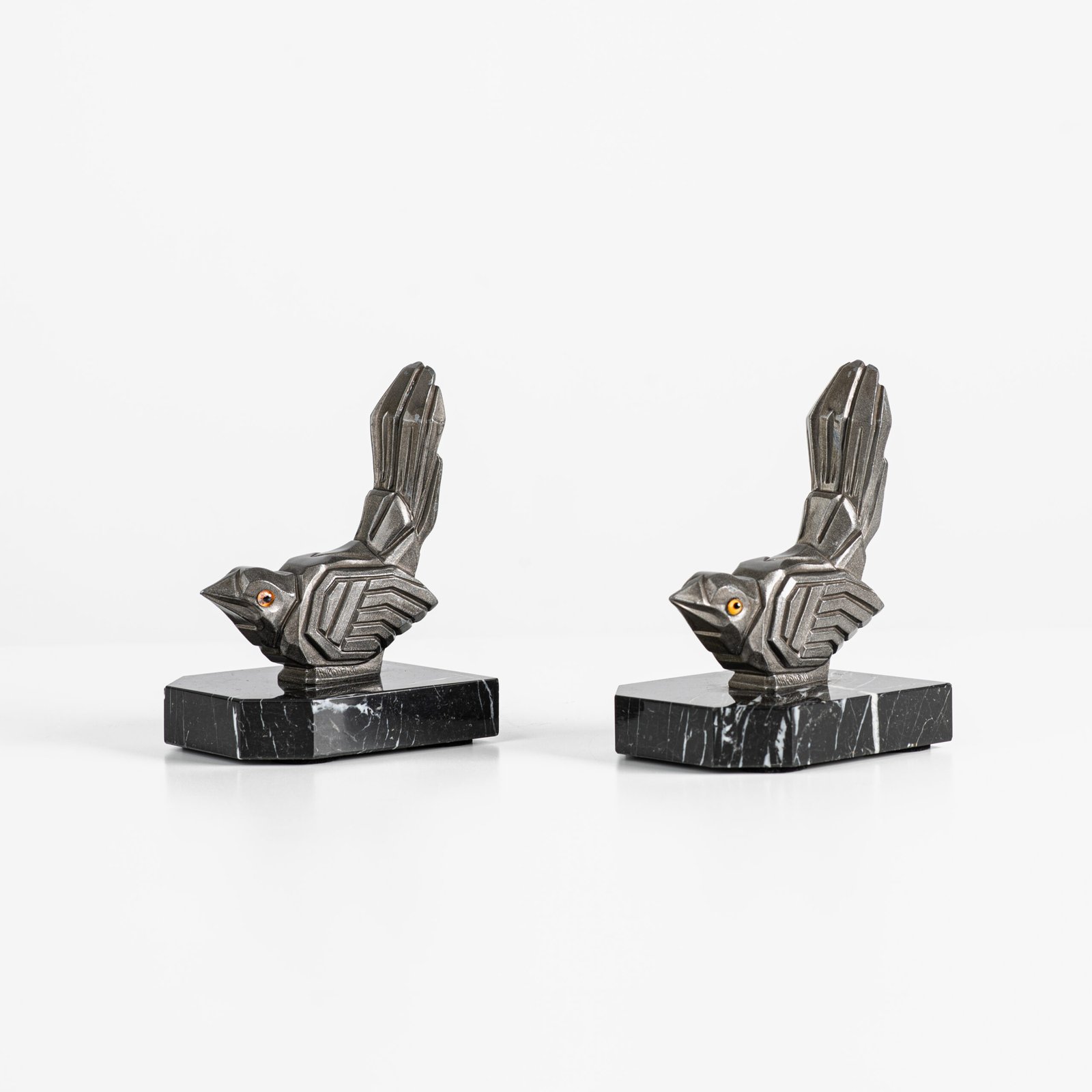 Hippolyte Moreau Art Deco Bookends, Cubist Birds in marble and spelter, 1930s This is an elegant pair of Art Deco bookends, signed by the celebrated French sculptor Hippolyte Moreau. These 1930s masterpieces depict two stylized birds with a bold cubist design.