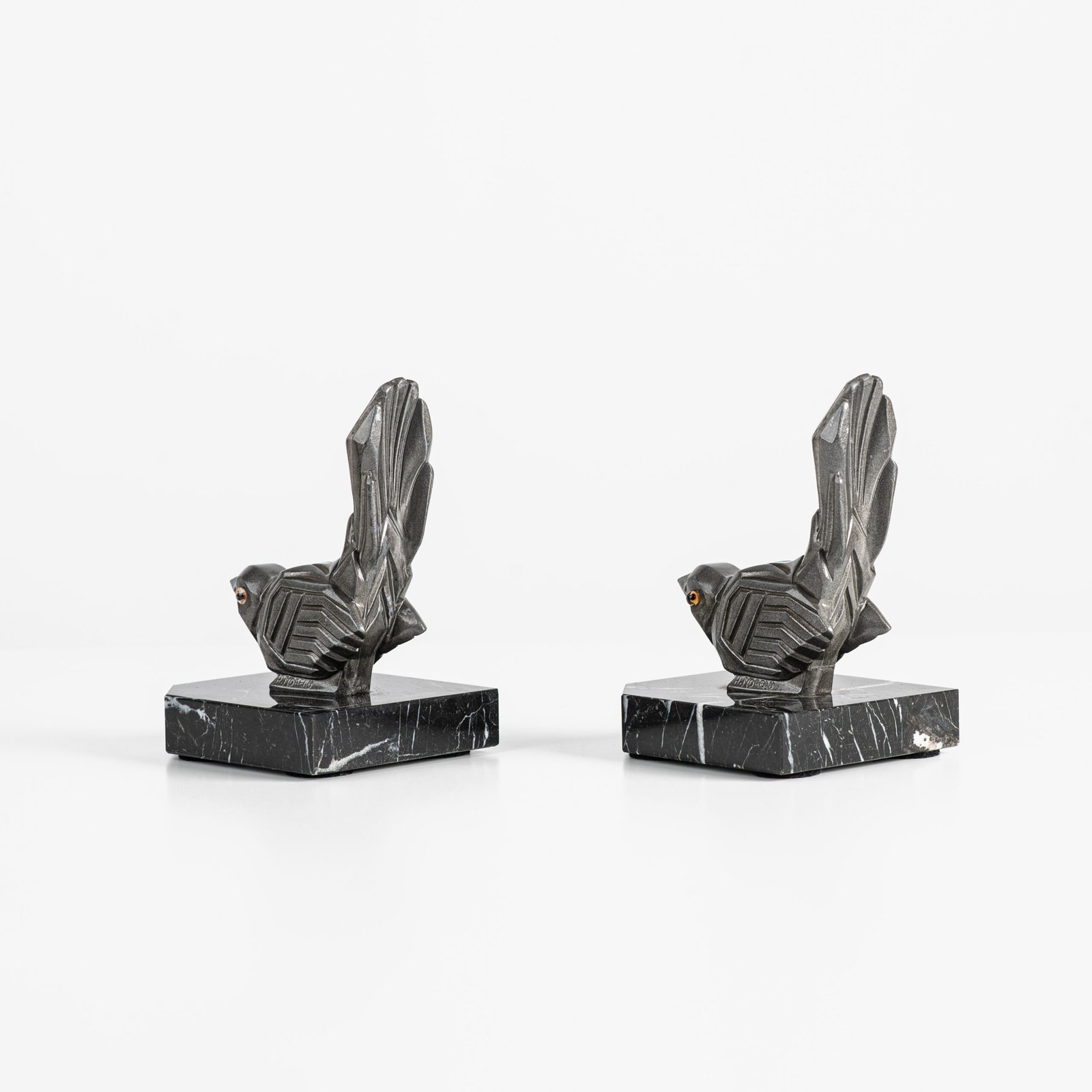 Hippolyte Moreau Art Deco Bookends, Cubist Birds in marble and spelter, 1930s This is an elegant pair of Art Deco bookends, signed by the celebrated French sculptor Hippolyte Moreau. These 1930s masterpieces depict two stylized birds with a bold cubist design.