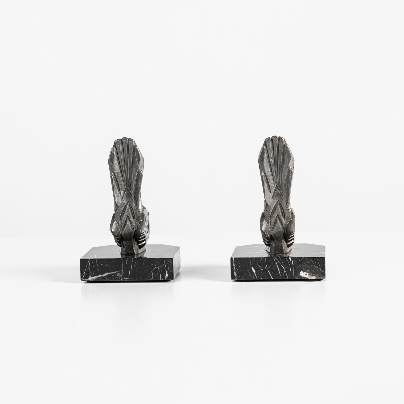 Hippolyte Moreau Art Deco Bookends, Cubist Birds in marble and spelter, 1930s This is an elegant pair of Art Deco bookends, signed by the celebrated French sculptor Hippolyte Moreau. These 1930s masterpieces depict two stylized birds with a bold cubist design.