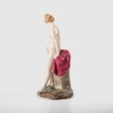 18th-century hard-paste porcelain sculpture titled “La Baigneuse”, modeled and signed in relief by Johann Peter Melchior, Höchst manufactory ca. 1775. Neoclassical nude figure with enamel decoration and fired gold detailing.