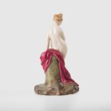 18th-century hard-paste porcelain sculpture titled “La Baigneuse”, modeled and signed in relief by Johann Peter Melchior, Höchst manufactory ca. 1775. Neoclassical nude figure with enamel decoration and fired gold detailing.