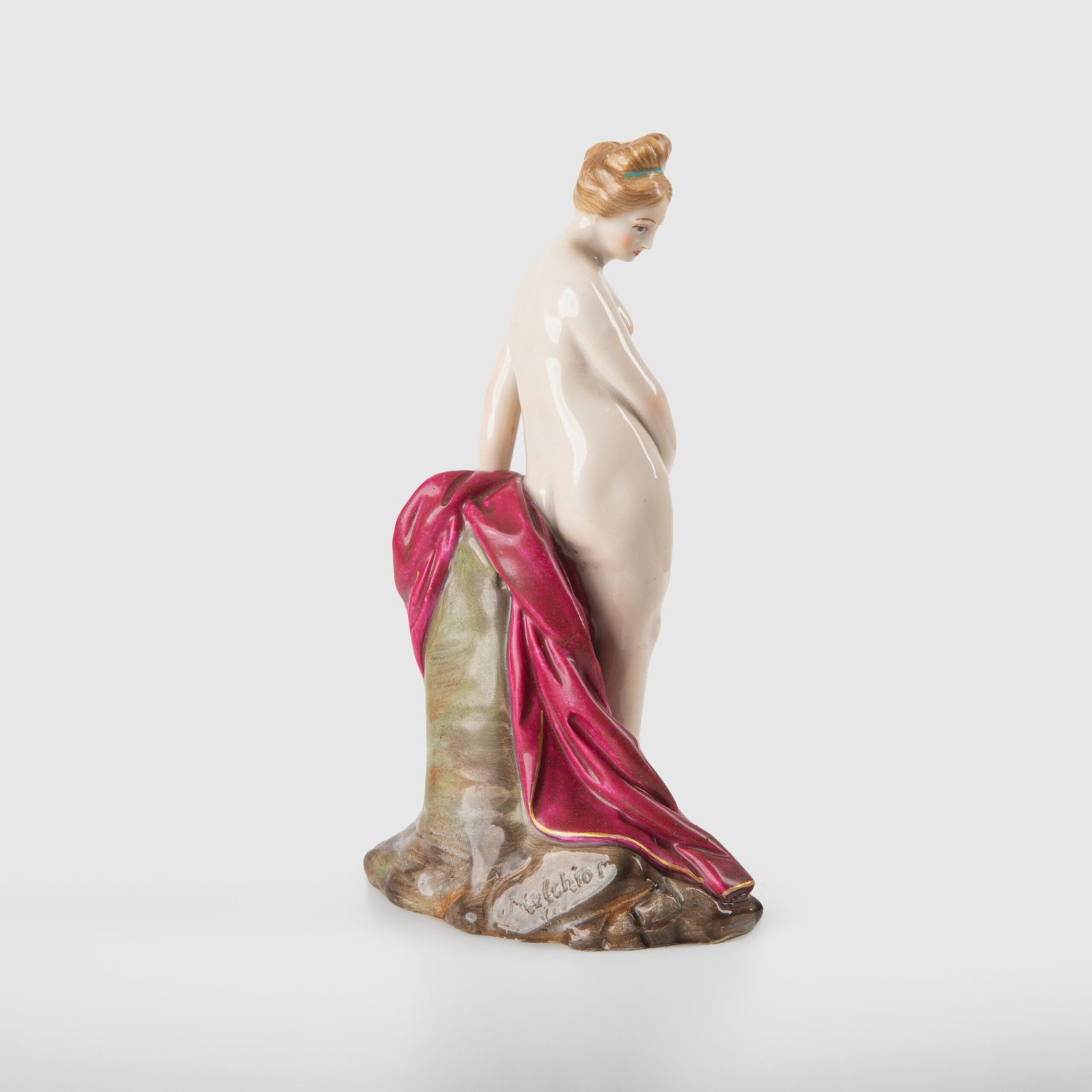 18th-century hard-paste porcelain sculpture titled “La Baigneuse”, modeled and signed in relief by Johann Peter Melchior, Höchst manufactory ca. 1775. Neoclassical nude figure with enamel decoration and fired gold detailing.