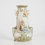 Antique German Art Nouveau Porcelain Vase by Karl Ens – Cupid and Maiden – Hand Painted, ca. 1900 This exceptional German Art Nouveau porcelain vase was crafted by Karl Ens Porzellanmanufaktur in the early 20th century, around 1900–1910. An exquisite example of Jugendstil decorative art. Dimensions: • Height: 15.7 in • Diameter: 9 in
