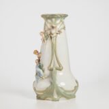 Antique German Art Nouveau Porcelain Vase by Karl Ens – Cupid and Maiden – Hand Painted, ca. 1900 This exceptional German Art Nouveau porcelain vase was crafted by Karl Ens Porzellanmanufaktur in the early 20th century, around 1900–1910. An exquisite example of Jugendstil decorative art. Dimensions: • Height: 15.7 in • Diameter: 9.1 in