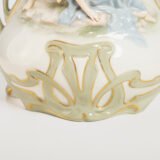 Antique German Art Nouveau Porcelain Vase by Karl Ens – Cupid and Maiden – Hand Painted, ca. 1900 This exceptional German Art Nouveau porcelain vase was crafted by Karl Ens Porzellanmanufaktur in the early 20th century, around 1900–1910. An exquisite example of Jugendstil decorative art. Dimensions: • Height: 15.7 in • Diameter: 9.1 in