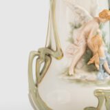Antique German Art Nouveau Porcelain Vase by Karl Ens – Cupid and Maiden – Hand Painted, ca. 1900 This exceptional German Art Nouveau porcelain vase was crafted by Karl Ens Porzellanmanufaktur in the early 20th century, around 1900–1910. An exquisite example of Jugendstil decorative art. Dimensions: • Height: 15.7 in • Diameter: 9.1 in