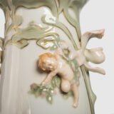 Antique German Art Nouveau Porcelain Vase by Karl Ens – Cupid and Maiden – Hand Painted, ca. 1900 This exceptional German Art Nouveau porcelain vase was crafted by Karl Ens Porzellanmanufaktur in the early 20th century, around 1900–1910. An exquisite example of Jugendstil decorative art. Dimensions: • Height: 15.7 in • Diameter: 9.1 in