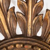Elegant sunburst mirror hand-carved in elm and gilded with gold leaf, made in Viana do Castelo (Portugal) circa 1920–1930. Original mirror, refined patina, and exceptional craftsmanship.