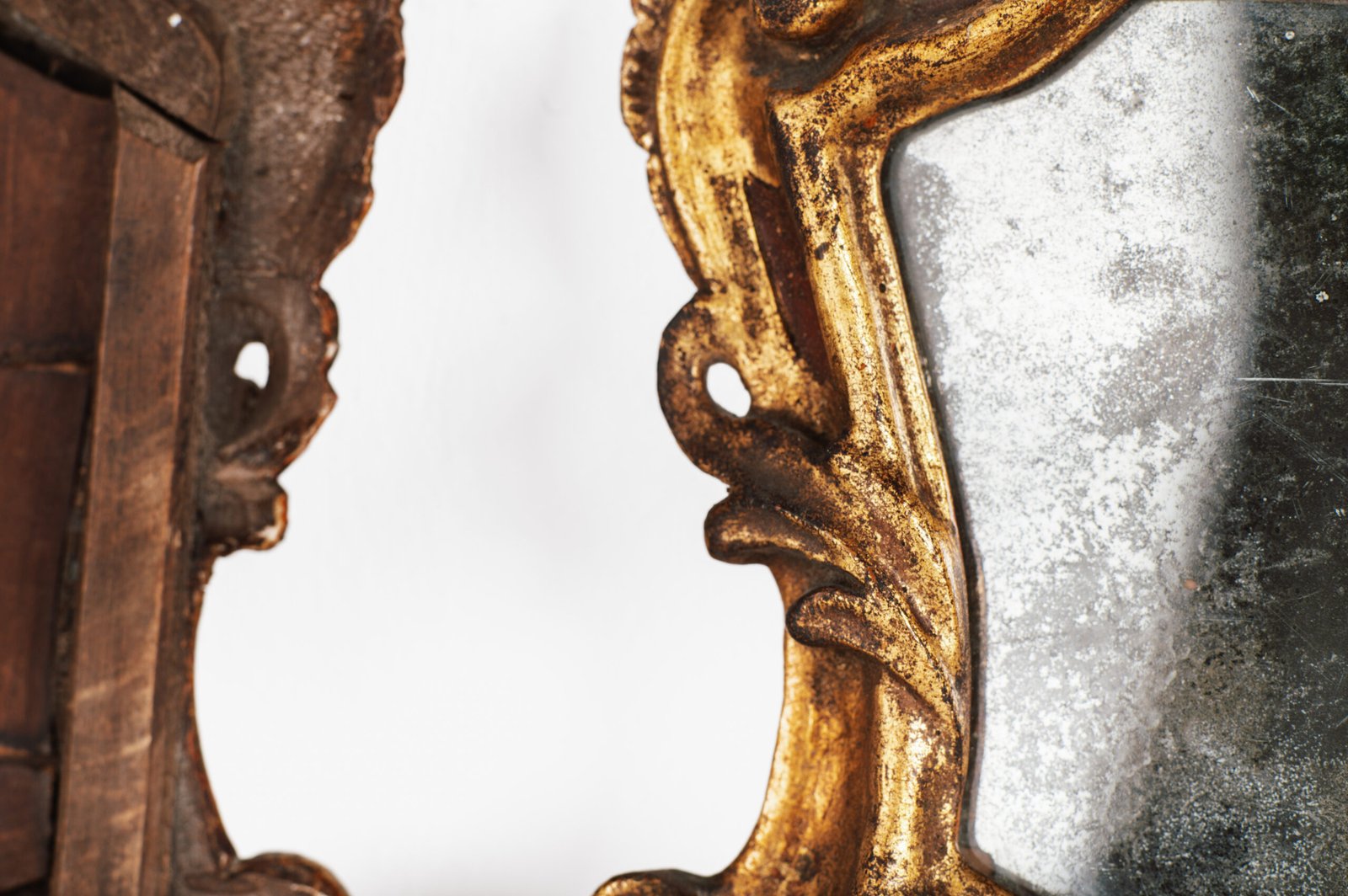 “Pair of 18th-century Italian Baroque devotional frames (cartas de gloria) with hand-carved wood, original gold leaf gilding, and mercury glass mirrors, Lombard-Venetian school.”