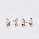 Delicate set of four hand-painted porcelain putti musicians crafted by the Höchst manufactory in Germany, circa 1767–1779. Each figure depicts a different musical instrument and bears the distinctive Höchst wheel mark with radiating spokes. Approx. 1.77 × 1.77 × 1.18 in. A fine example of late Rococo artistry.