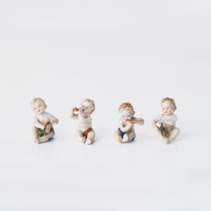 Delicate set of four hand-painted porcelain putti musicians crafted by the Höchst manufactory in Germany, circa 1767–1779. Each figure depicts a different musical instrument and bears the distinctive Höchst wheel mark with radiating spokes. Approx. 1.77 × 1.77 × 1.18 in. A fine example of late Rococo artistry.