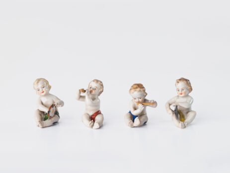 Exceptional Höchst Porcelain Putti set of four musical Rococo figures, hand-painted ca. 1767–1779, each marked with the Höchst six-spoked wheel.