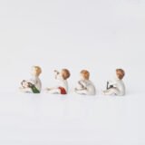 Delicate set of four hand-painted porcelain putti musicians crafted by the Höchst manufactory in Germany, circa 1767–1779. Each figure depicts a different musical instrument and bears the distinctive Höchst wheel mark with radiating spokes. Approx. 1.77 × 1.77 × 1.18 in. A fine example of late Rococo artistry.
