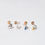 Delicate set of four hand-painted porcelain putti musicians crafted by the Höchst manufactory in Germany, circa 1767–1779. Each figure depicts a different musical instrument and bears the distinctive Höchst wheel mark with radiating spokes. Approx. 1.77 × 1.77 × 1.18 in. A fine example of late Rococo artistry.