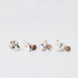 Delicate set of four hand-painted porcelain putti musicians crafted by the Höchst manufactory in Germany, circa 1767–1779. Each figure depicts a different musical instrument and bears the distinctive Höchst wheel mark with radiating spokes. Approx. 1.77 × 1.77 × 1.18 in. A fine example of late Rococo artistry.