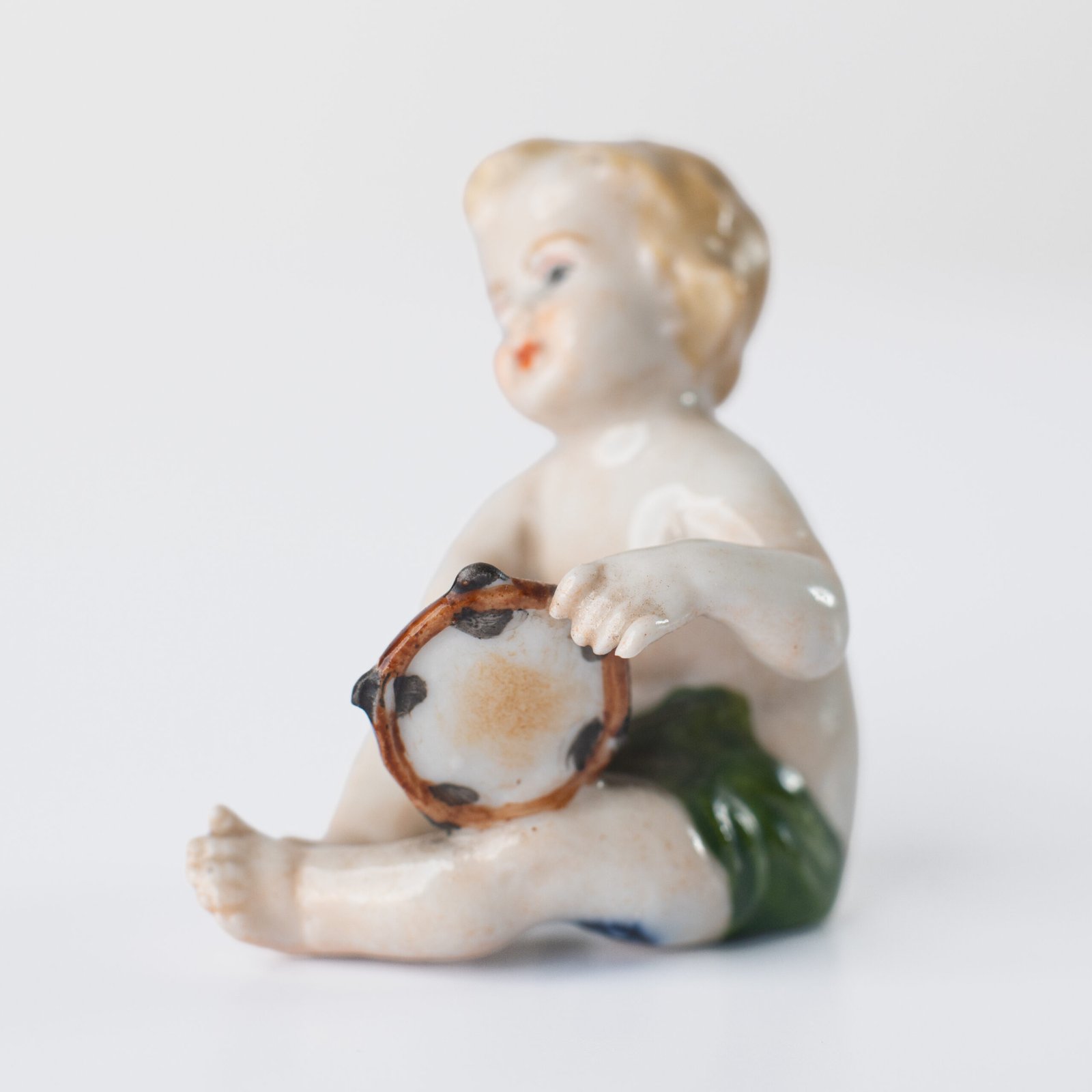 Delicate set of four hand-painted porcelain putti musicians crafted by the Höchst manufactory in Germany, circa 1767–1779. Each figure depicts a different musical instrument and bears the distinctive Höchst wheel mark with radiating spokes. Approx. 1.77 × 1.77 × 1.18 in. A fine example of late Rococo artistry.